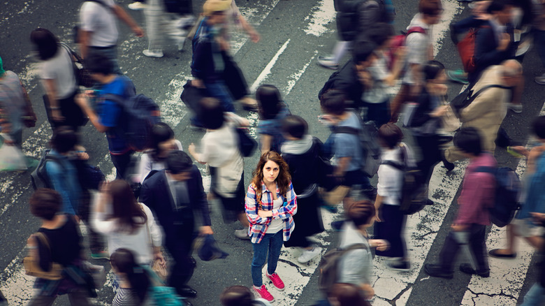 Confused woman in a crowd of people