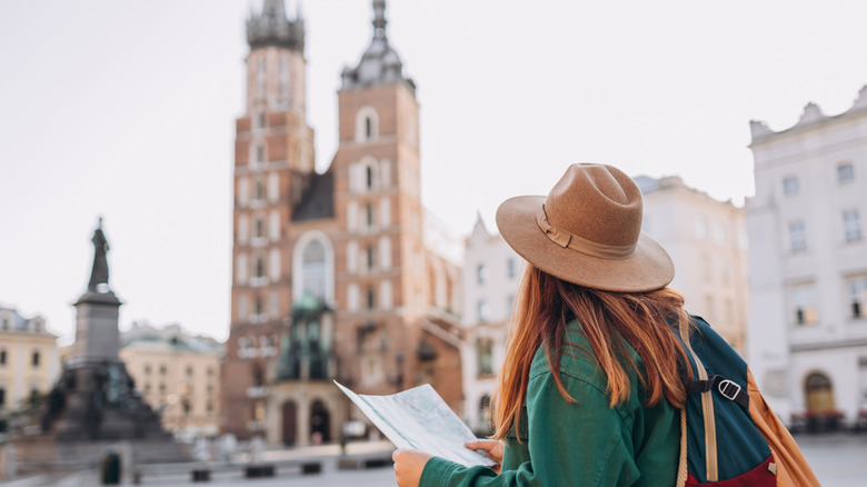 Woman looking at a map in Krakow