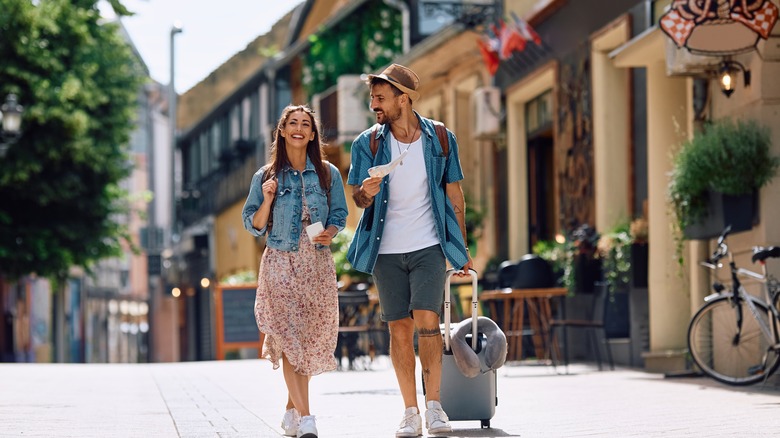 Woman and man walking in street