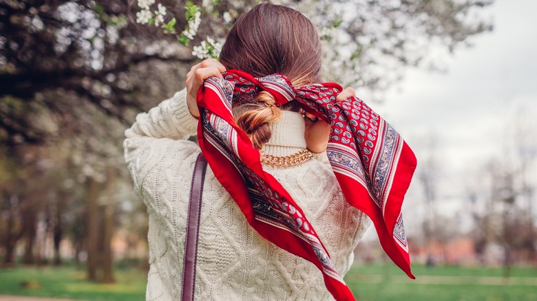 Woman with silk hair scarf