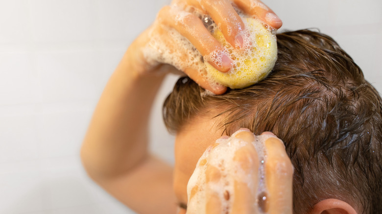 Man washing hair shampoo bar