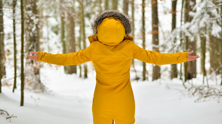 Woman outside in snowy forest