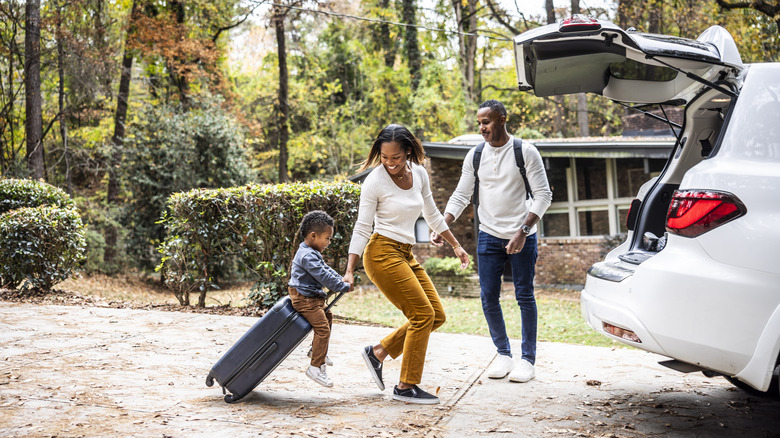 Traveling family packing car