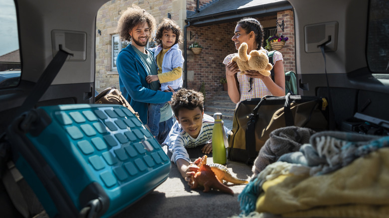 Family packing car for trip