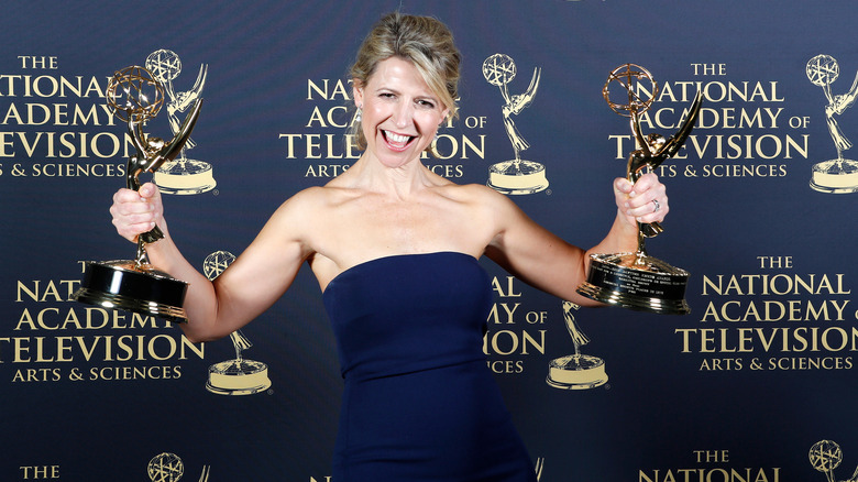 Samantha Brown holding her two 2019 Emmy Awards