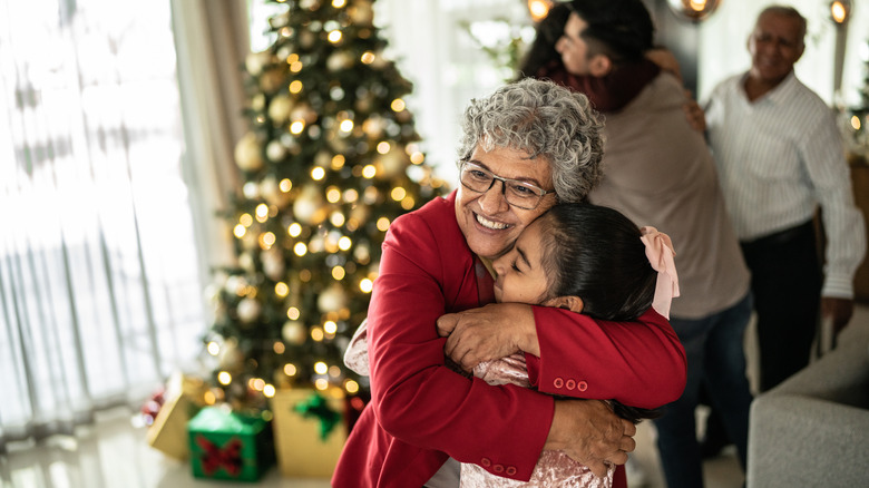 Grandma hugging granddaughter at Christmas