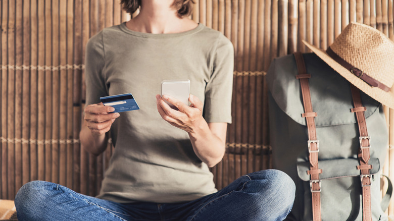 Woman comparing credit cards