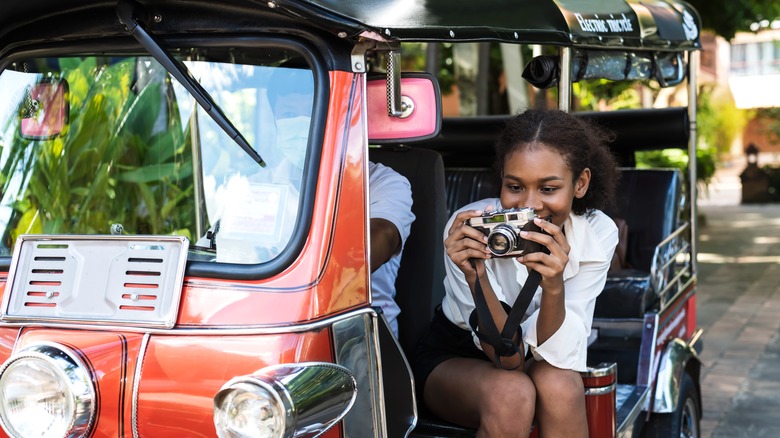 tourist in tuk-tuk in Thailand