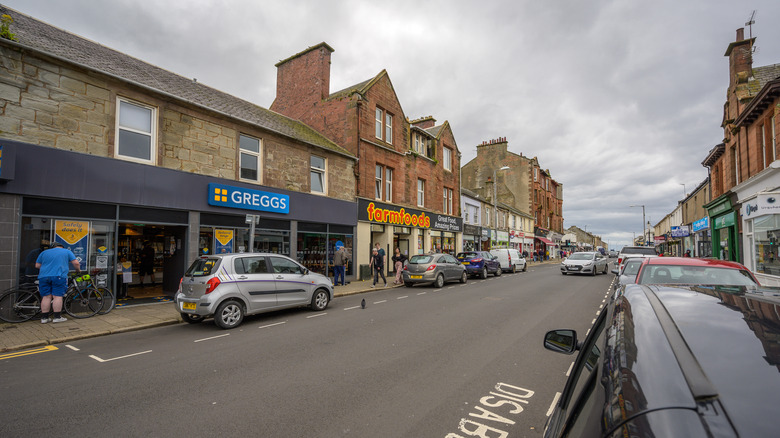 Shops and restaurants in stone buildings in Troon