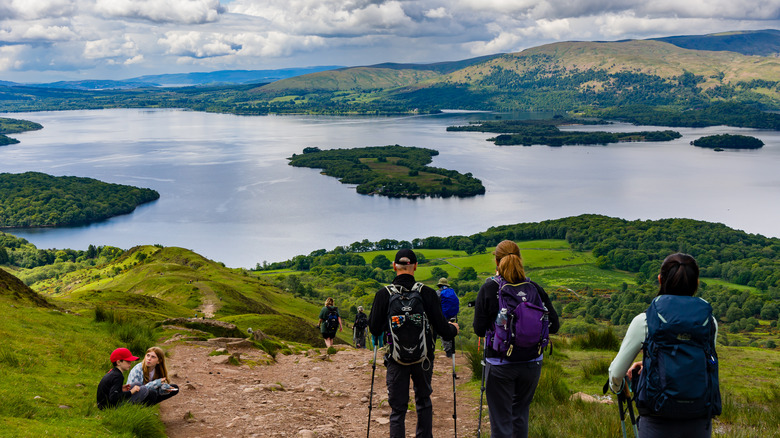 Hikers approach Loch Lomond, Scotland