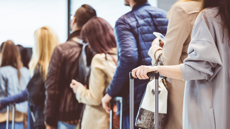 Line of passengers at airport