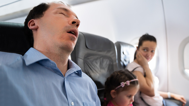 Loud snoring plane passenger