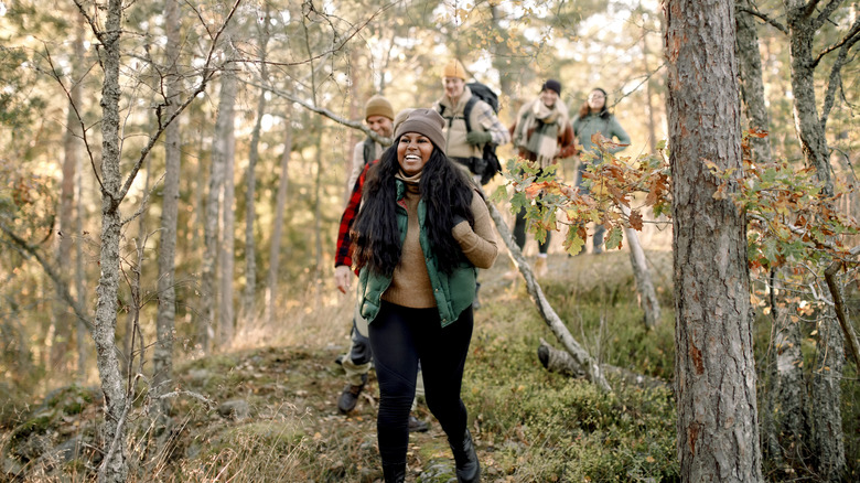 Hikers surrounded by fall foliage