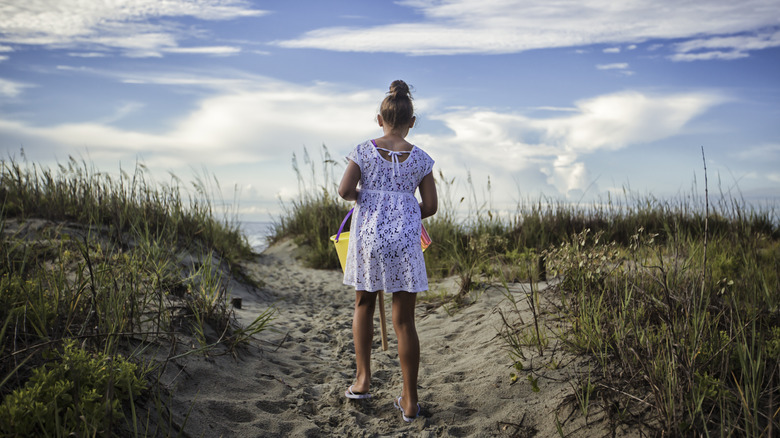 young girl sand dunes