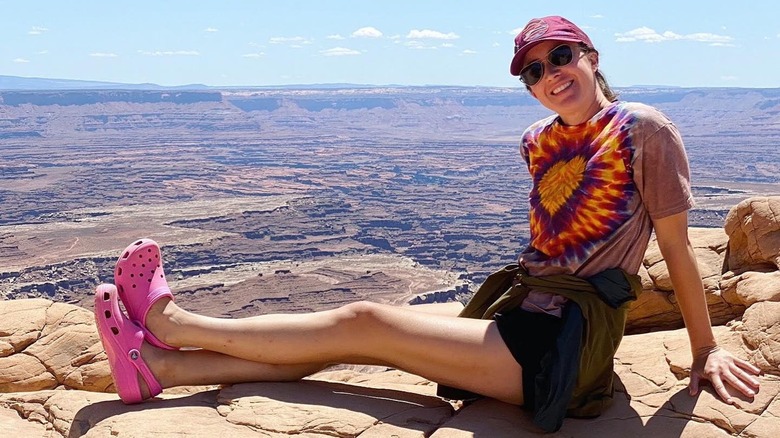 woman hiking in Crocs