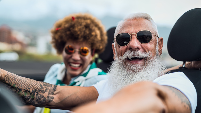 Happy couple in convertible