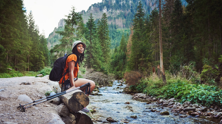 Solo female hiker sitting