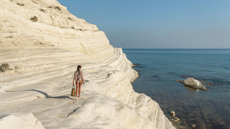 Woman walking on the beach at the Scala Dei Turchi, Sicily