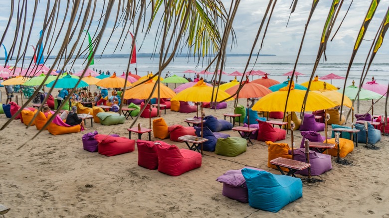 Tourists relaxing at Seminyak Beach in Bali