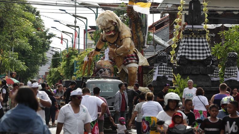 Locals prepare for an Ogoh-ogoh parade before Nyepi