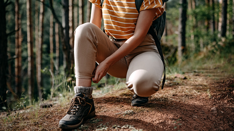 person backpack and hiking boots