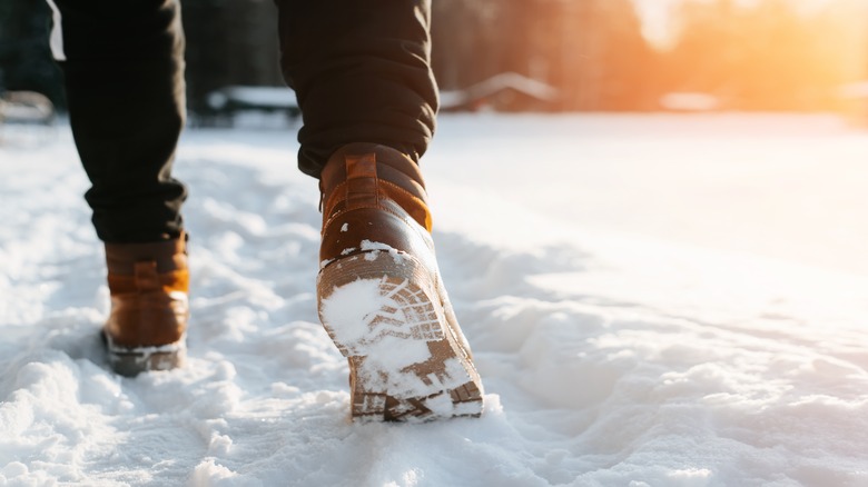 Winter boots walking in snow