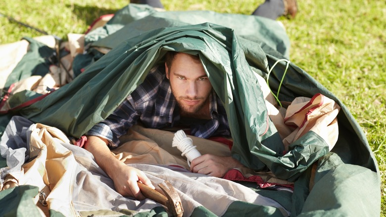Man can't erect tent