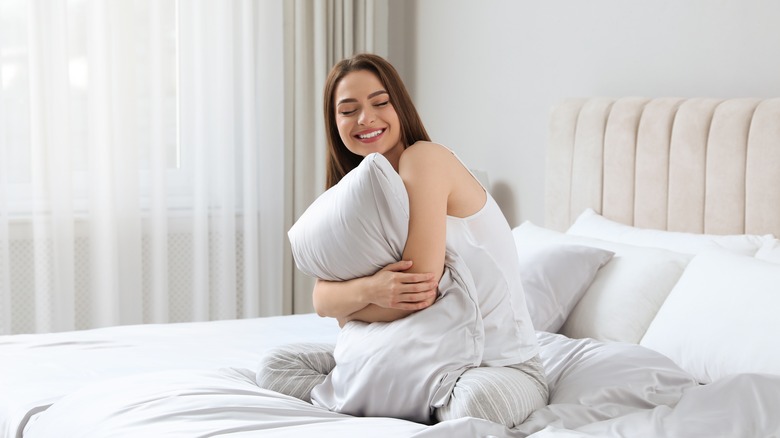 Girl hugging pillow