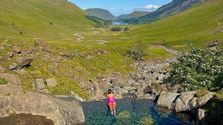 Woman swimming in the Buttermere Valley infinity pool