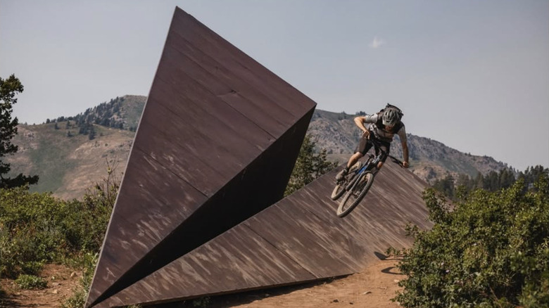 A biker on Powder Mountain's "paper airplane" by Griffin Loop.