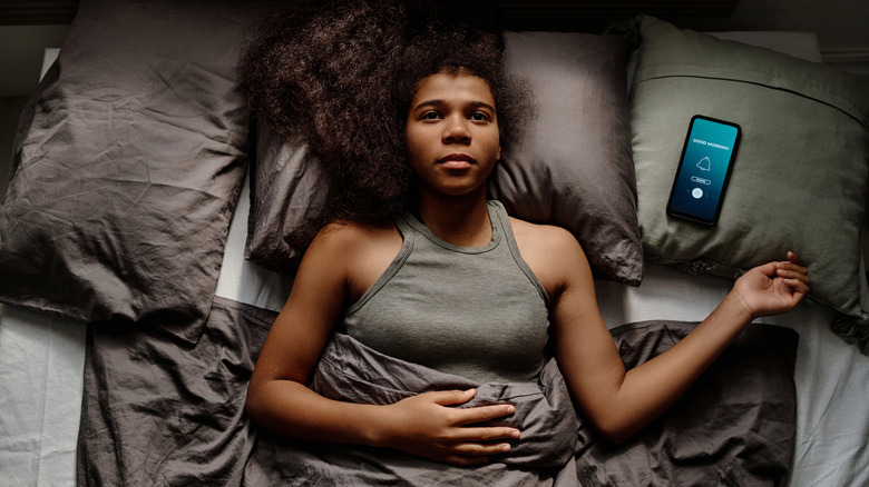 Hotel guest awake in bed