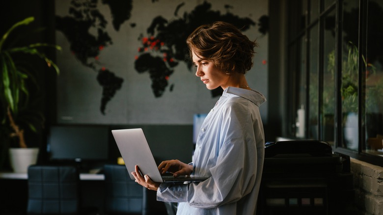 Woman holding a laptop