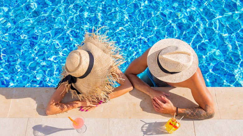 couple in pool at resort