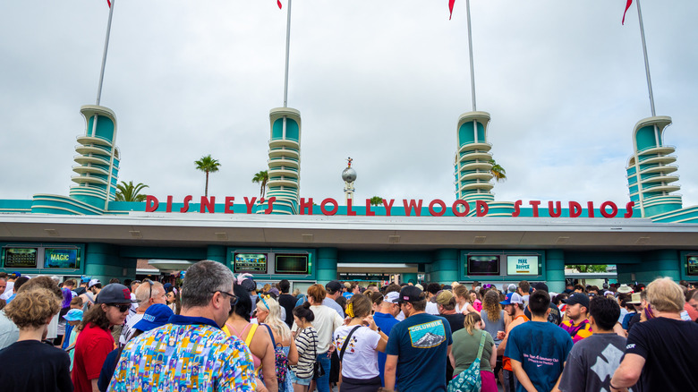 A crowd of people at Disney's Hollywood Studios entrance.