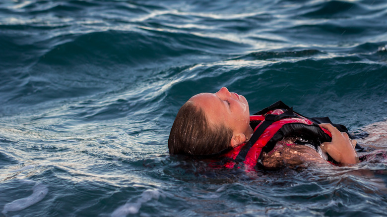 girl with life vest in the water