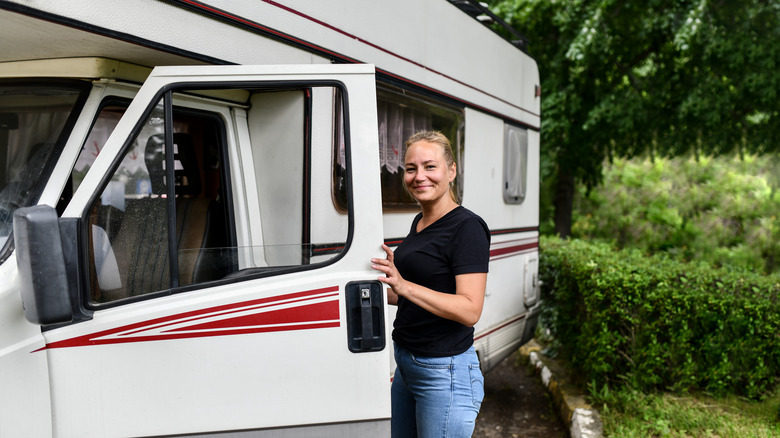 woman standing in front of RV