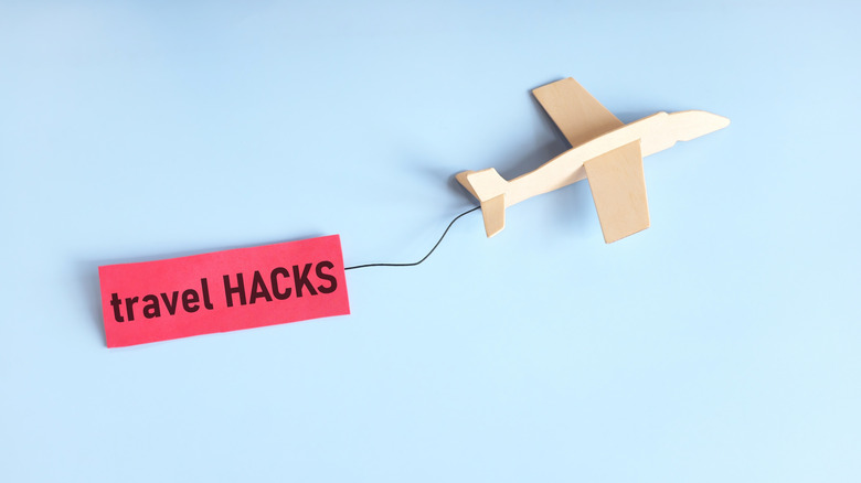 A model airplane with travel hacks attached