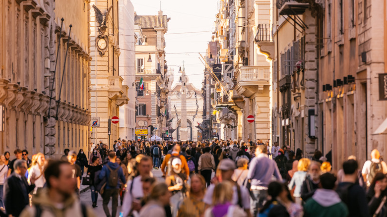 Travelers and locals walking together abroad