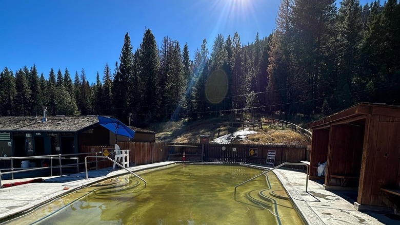 outdoor pool with wooden huts