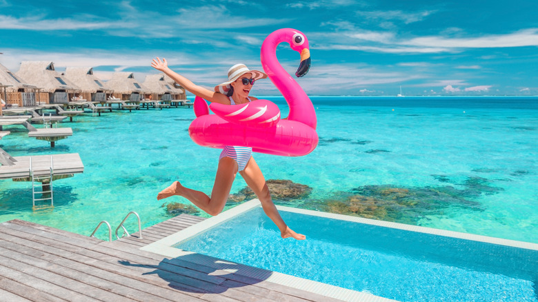 happy woman with flamingo float