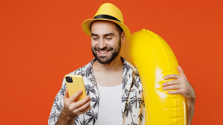 man happily communicating on phone