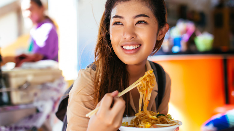 girl eating street food