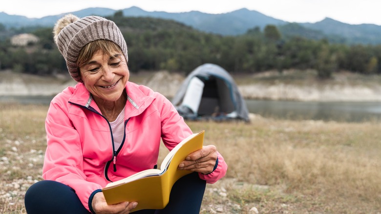 person reading in nature