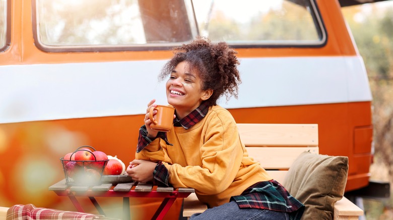 woman smiling while car camping