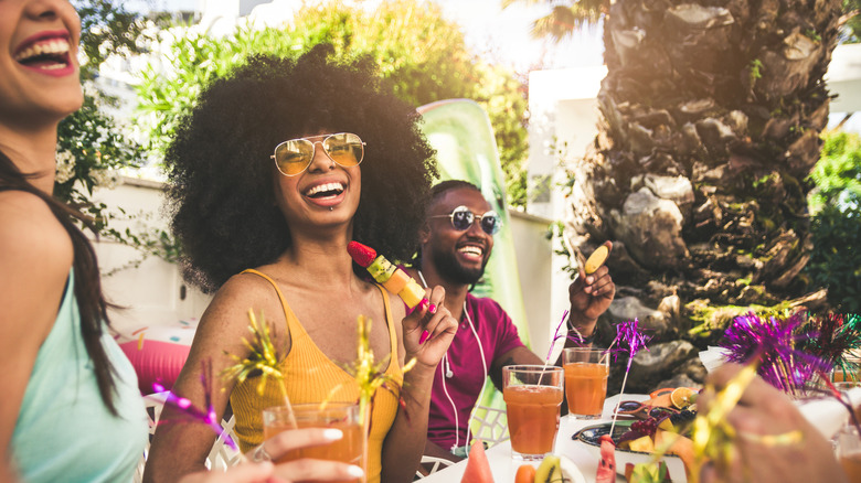 people smiling at restaurant bar