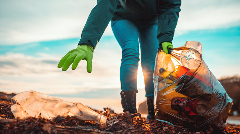 volunteer picking up trash