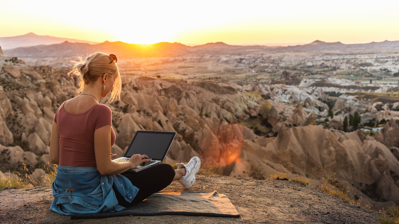 Solo traveler on laptop