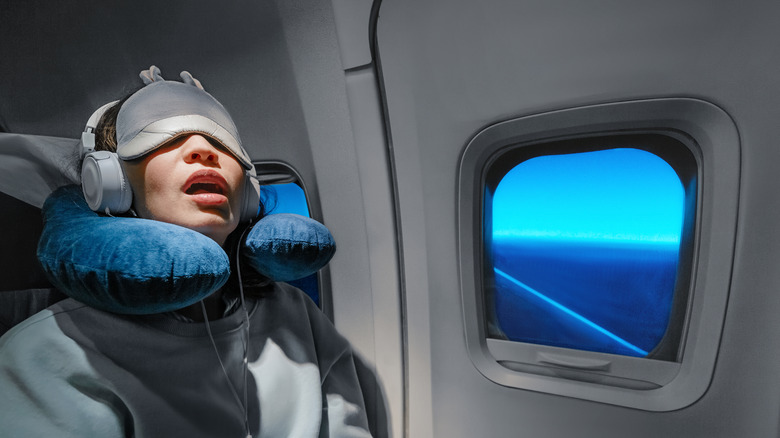 Girl asleep on plane