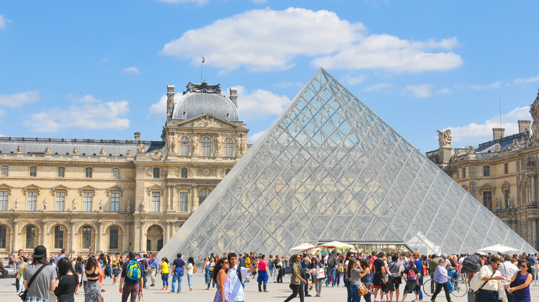 outside The Louvre museum with lots of people