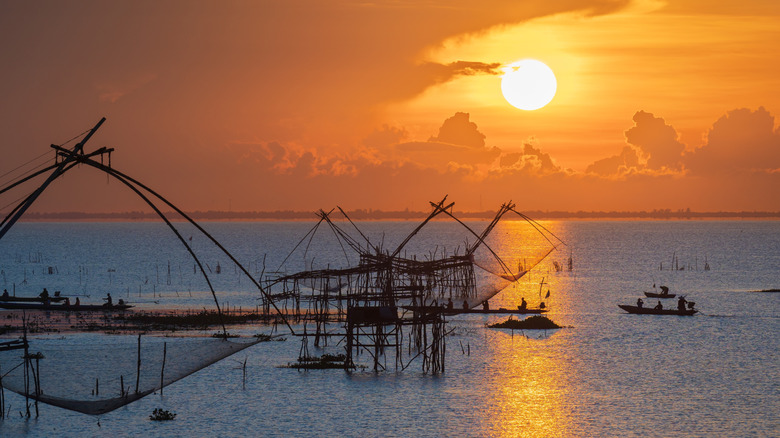 traditional fishing nets sunrise